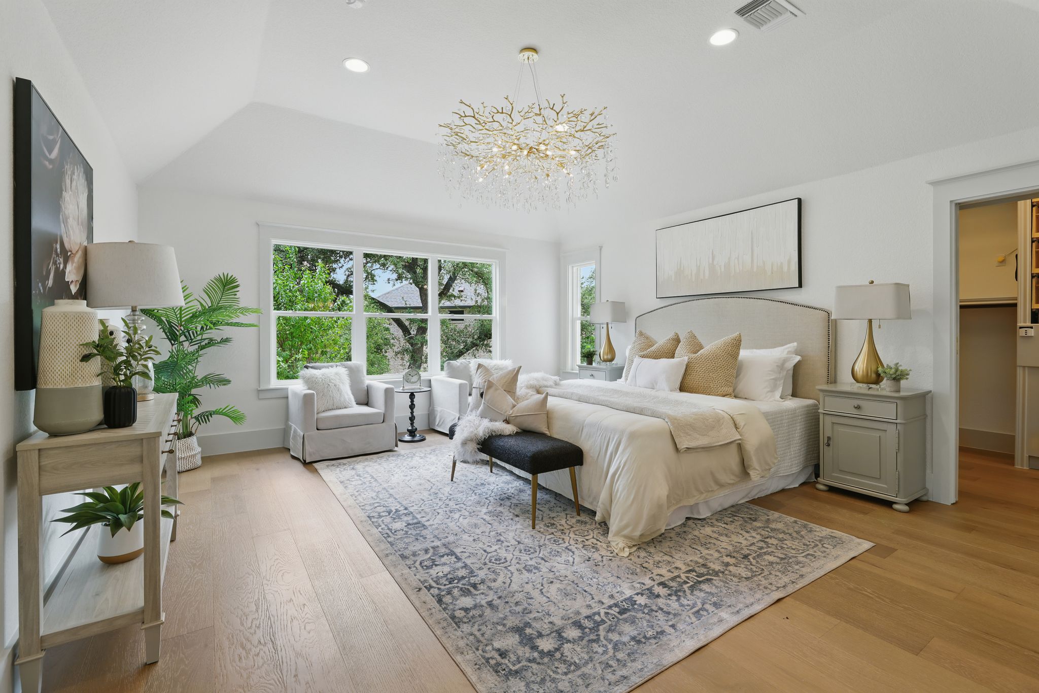 6905 Rudi Cove Austin, TX 78759 - Photo 21 of 37 Vaulted ceilings and broad windows define this spacious bedroom, offering abundant natural light and tranquil views.
