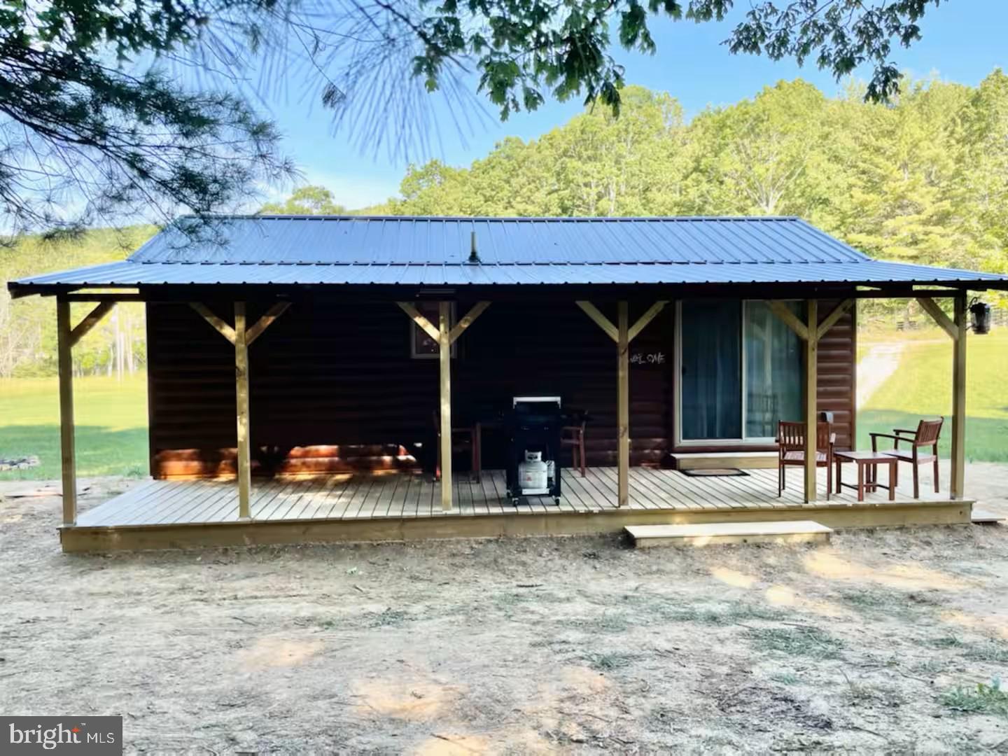 184 Skiles- Pitsenbarger Road Franklin, WV 26807 - Photo 6 of 39 Charming cabin nestled in nature's embrace.