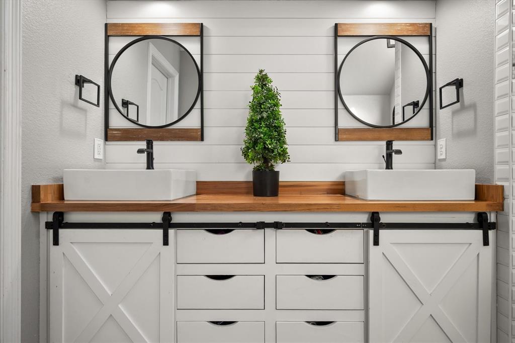 212 Ashmore Place Haslet, TX 76052 - Photo 23 of 39 Bathroom with a textured wall and double vanity