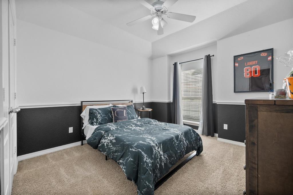 212 Ashmore Place Haslet, TX 76052 - Photo 24 of 39 Bedroom with carpet flooring and a ceiling fan