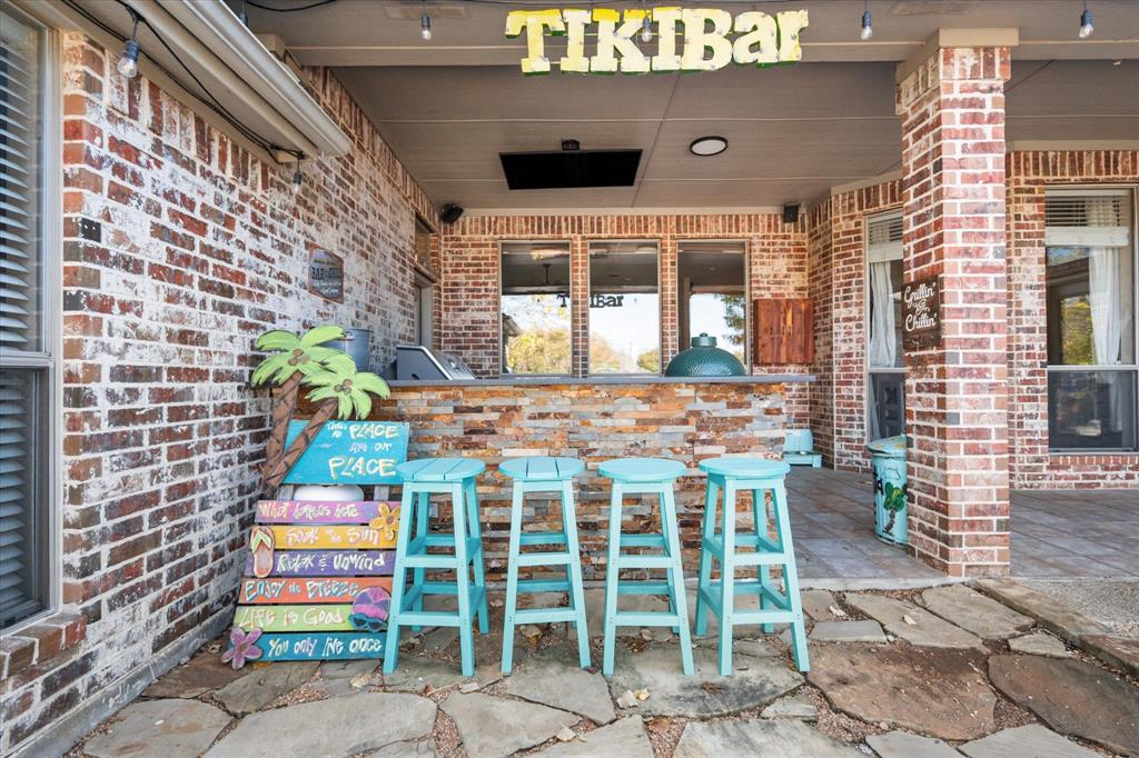 212 Ashmore Place Haslet, TX 76052 - Photo 35 of 39 View of patio with exterior kitchen and an outdoor bar