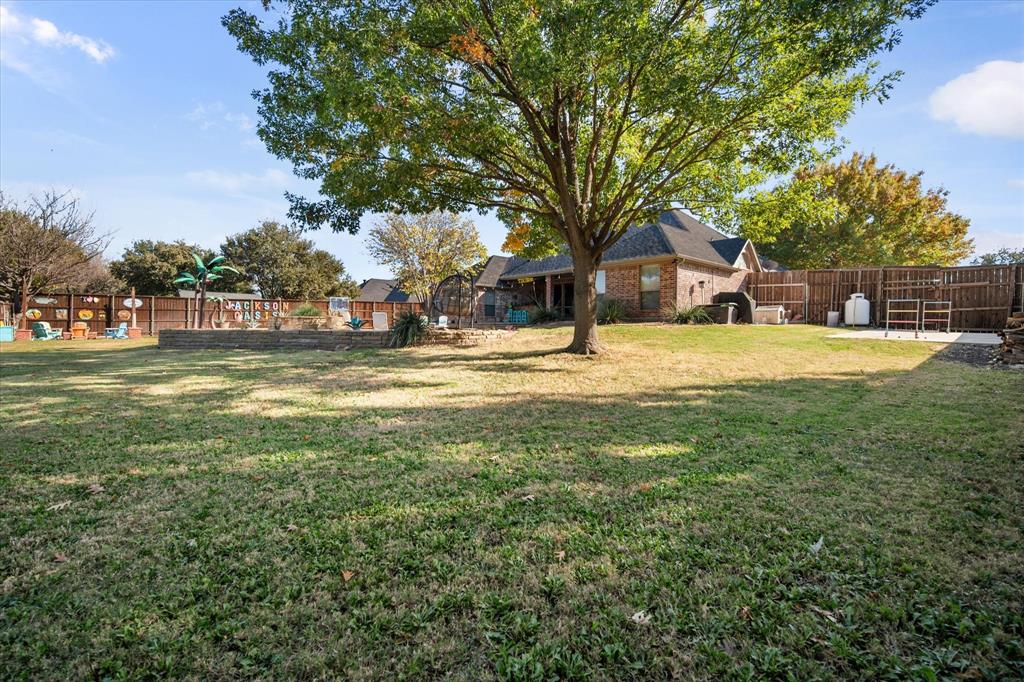 212 Ashmore Place Haslet, TX 76052 - Photo 37 of 39 View of fenced backyard