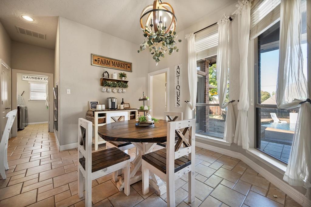 212 Ashmore Place Haslet, TX 76052 - Photo 10 of 39 Dining space with a chandelier and recessed lighting