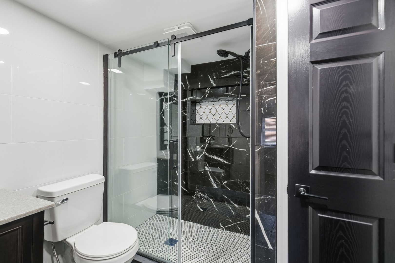 11622 27th Street West Milan, IL 61264 - Photo 20 of 49 a bathroom with a shower toilet and sink