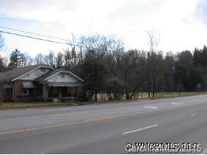 a group of cars parked in front of house