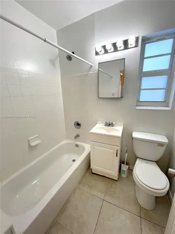 a bathroom with a sink a toilet and a bathtub