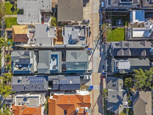 an aerial view of residential houses with outdoor space