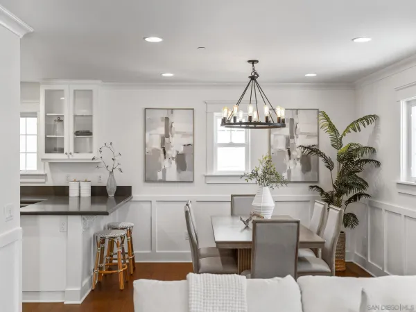 a living room with furniture a chandelier and a chandelier