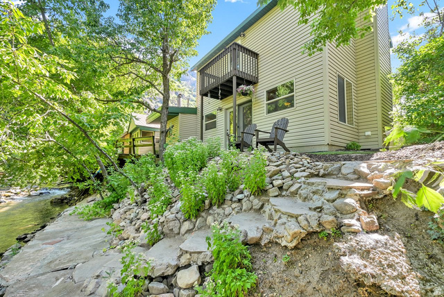 655 Ogden Canyon Road Ogden, UT 84401 - Photo 7 of 50 Riverside property featuring a multi-level rock and concrete pathway, a private upper deck, and a lower patio area