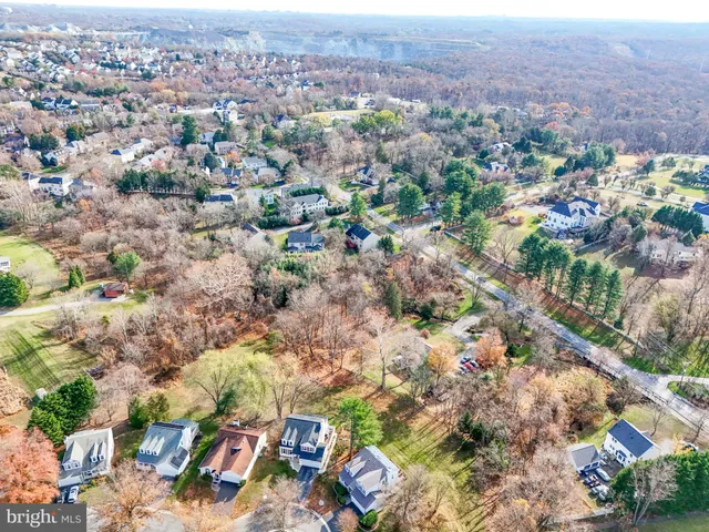 an aerial view of multiple house with yard