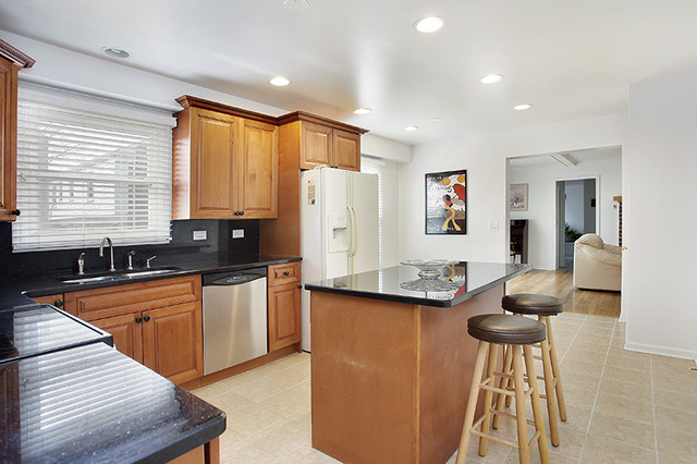 300 Lee Road Northbrook, IL 60062 - Photo 8 of 19 a kitchen with stainless steel appliances granite countertop a sink and a refrigerator