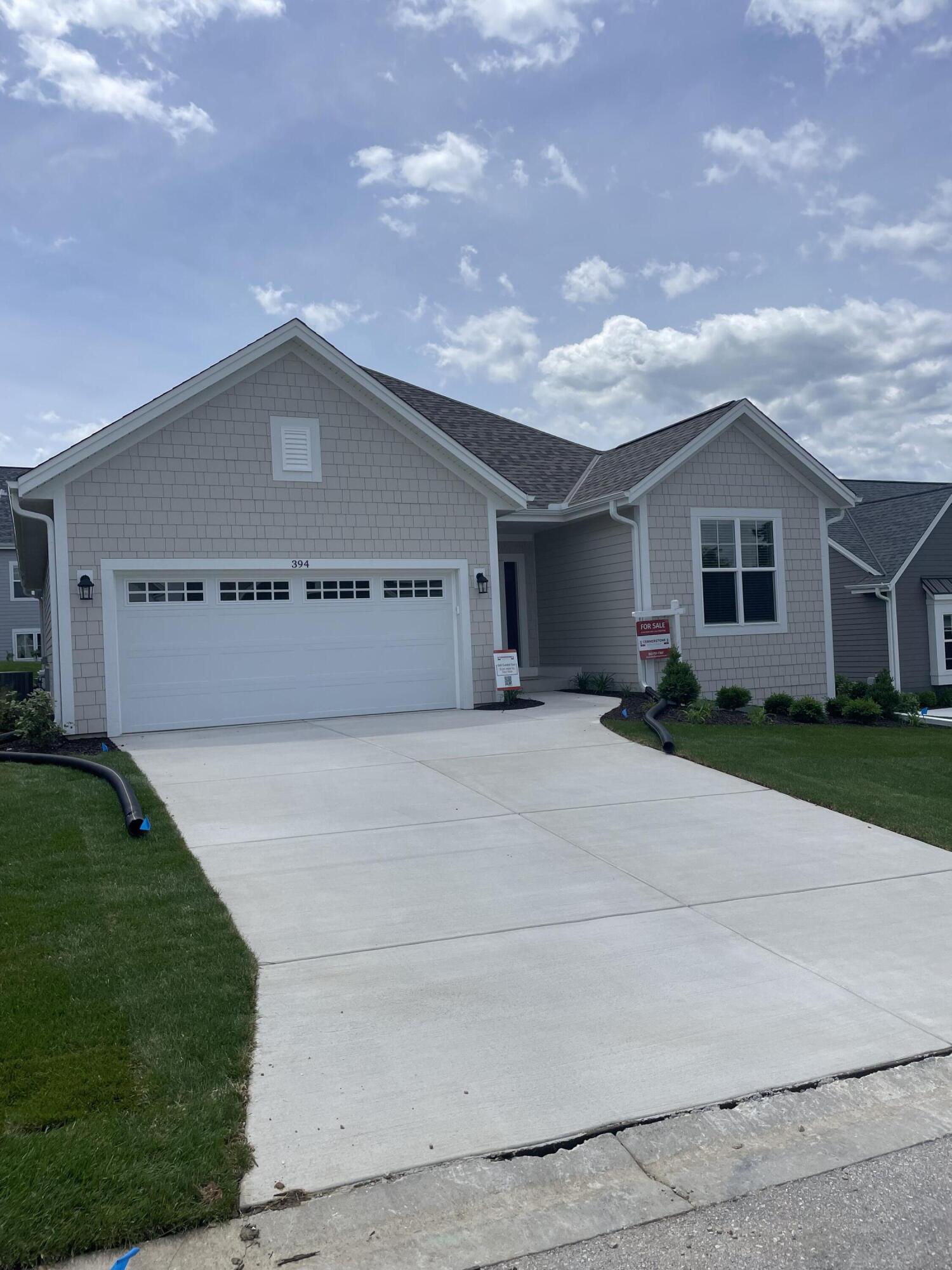 394 Sandy Circle Pewaukee, WI 53072 - Photo 1 of 34 Holly Front of Home