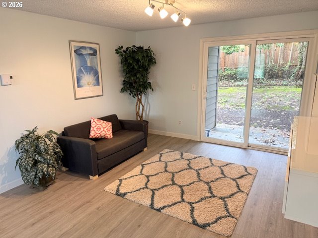 12628 Northwest Barnes Road, Unit 6 Portland, OR 97229 - Photo 3 of 13 a living room with furniture and a large window
