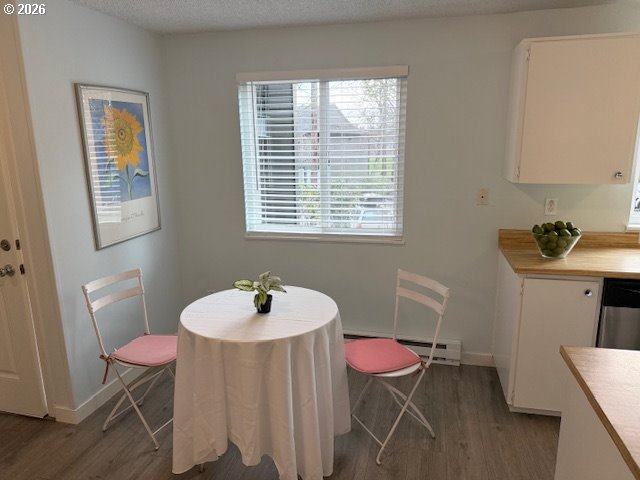 12628 Northwest Barnes Road, Unit 6 Portland, OR 97229 - Photo 5 of 13 a view of a dining room with furniture and wooden floor