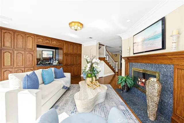 a kitchen with stainless steel appliances granite countertop a sink and dishwasher a refrigerator with wooden cabinets