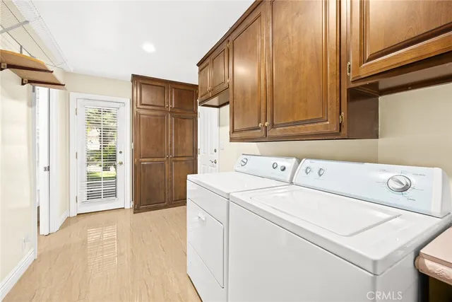 a room with pool table and windows