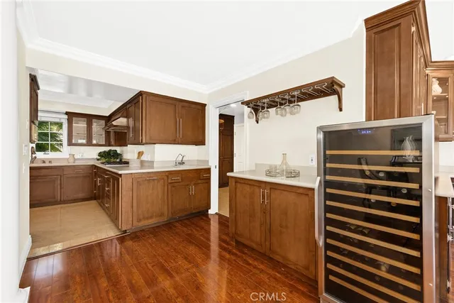 a room with pool table and windows