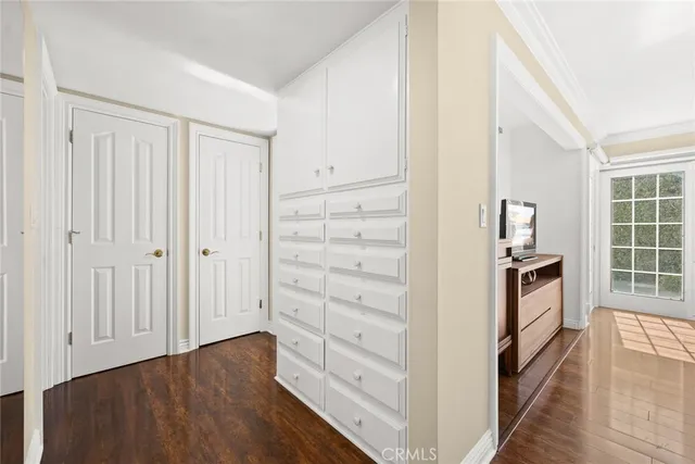 a view of a balcony with wooden floor and a window