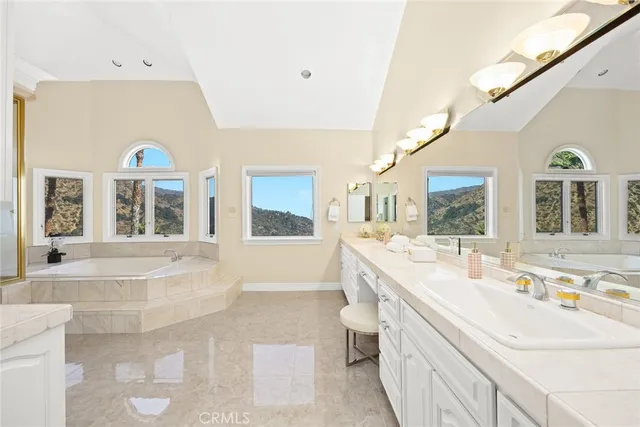 a front view of a house with a garden and yard