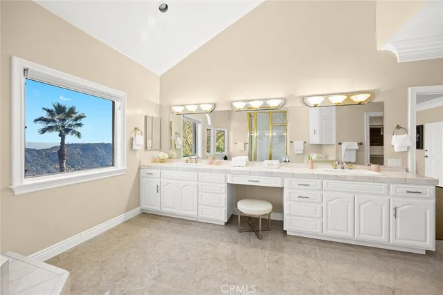 a view of a chairs and table in the balcony