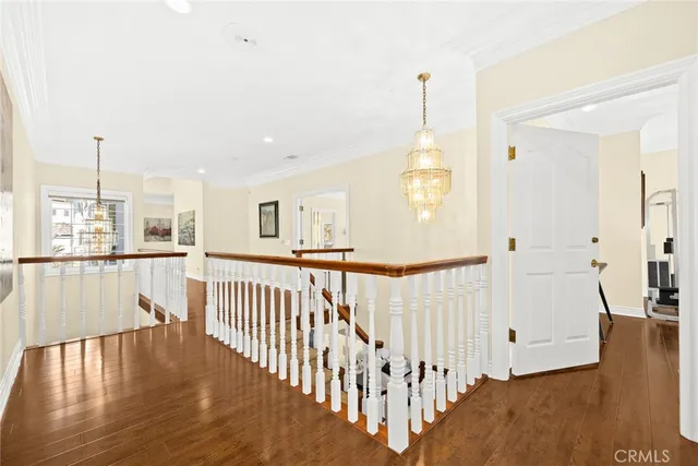 an aerial view of a house with garden space and a street view