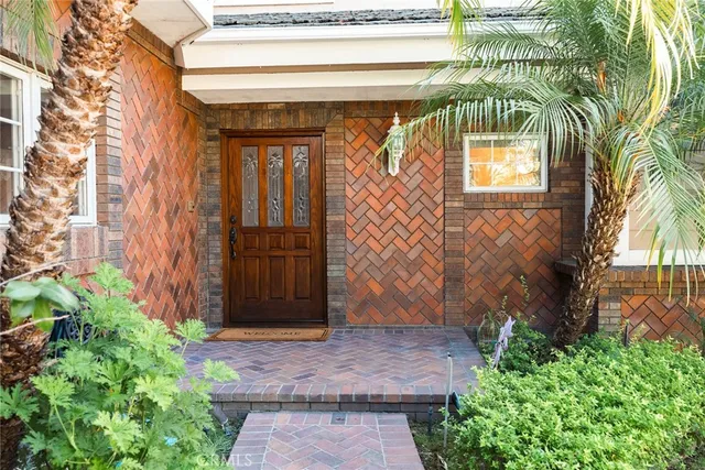 a view of a entryway door with a rug