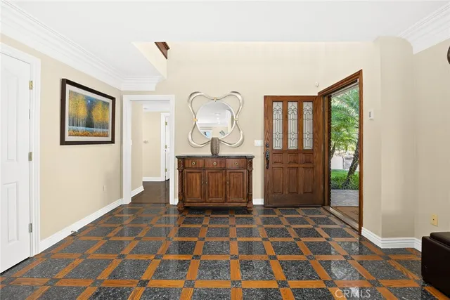 a view of a livingroom with wooden floor and a rug