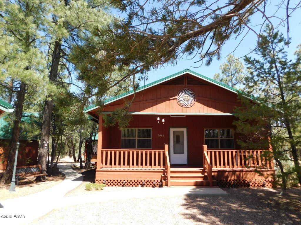 2968 Monica Road Overgaard, AZ 85933 - Photo 2 of 29 a view of a house with a small yard