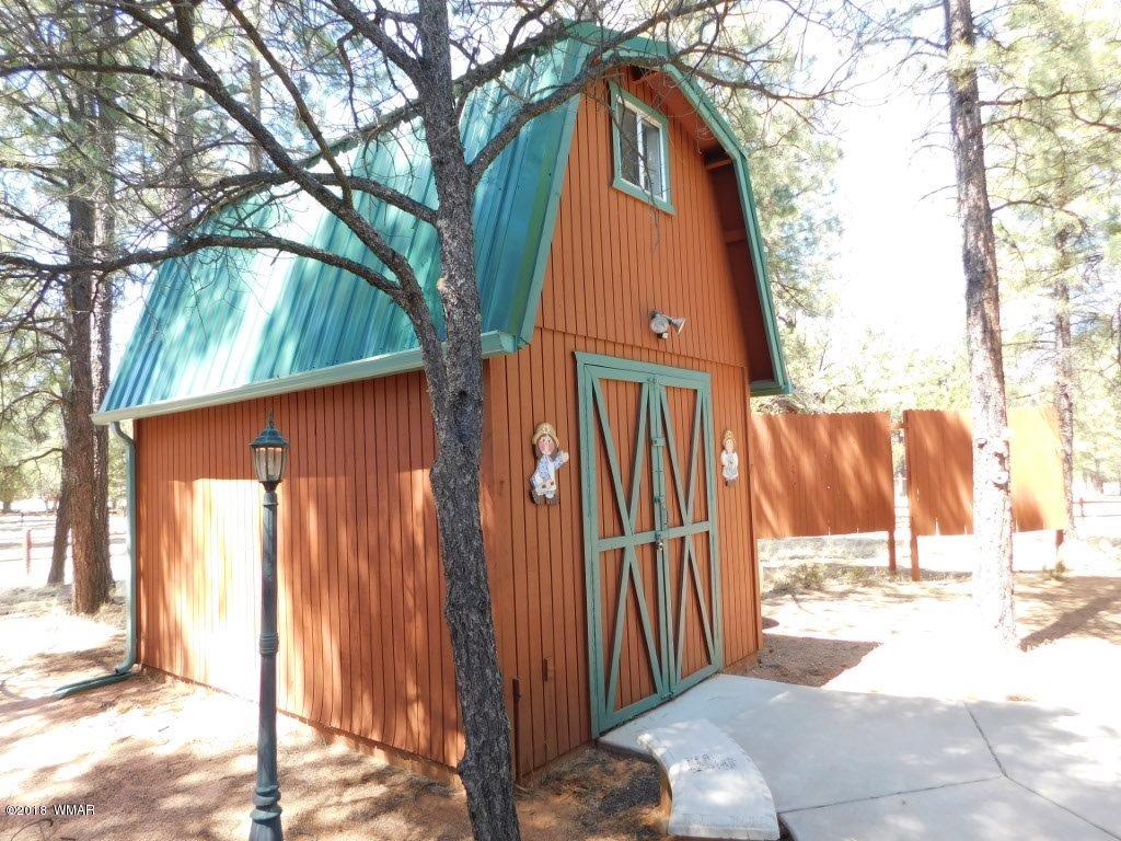 2968 Monica Road Overgaard, AZ 85933 - Photo 4 of 29 a view of a house with a tree