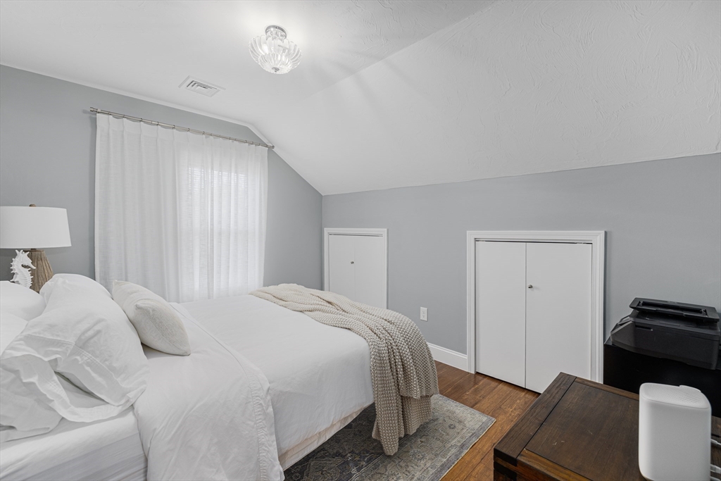 69 Denver Street Fall River, MA 02721 - Photo 33 of 35 a bedroom with a bed and a couch