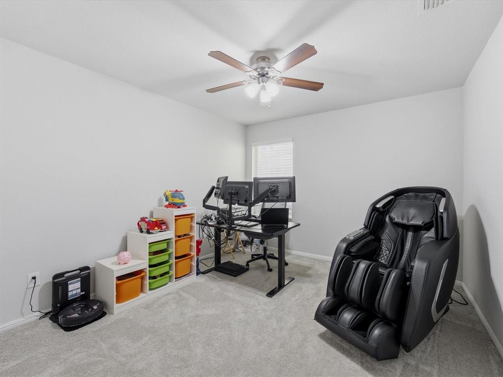 6000 Sutton Fields Trail Aubrey, TX 76227 - Photo 23 of 40 Bedroom with light carpet and a ceiling fan