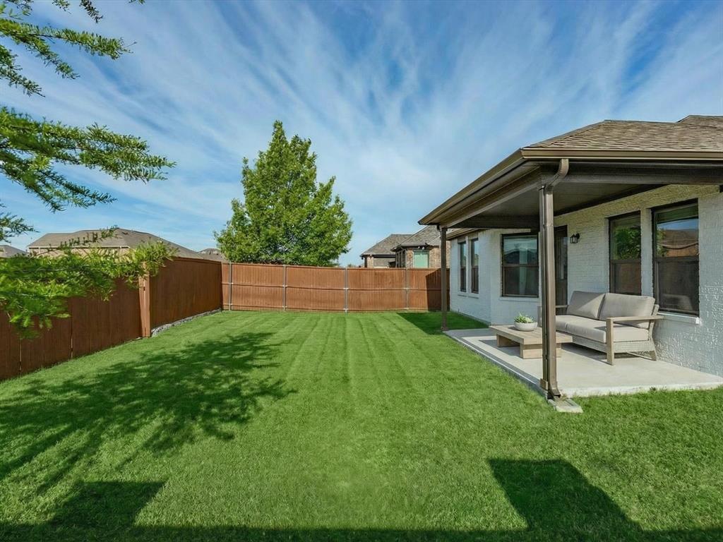 6000 Sutton Fields Trail Aubrey, TX 76227 - Photo 27 of 40 Fenced backyard with a patio