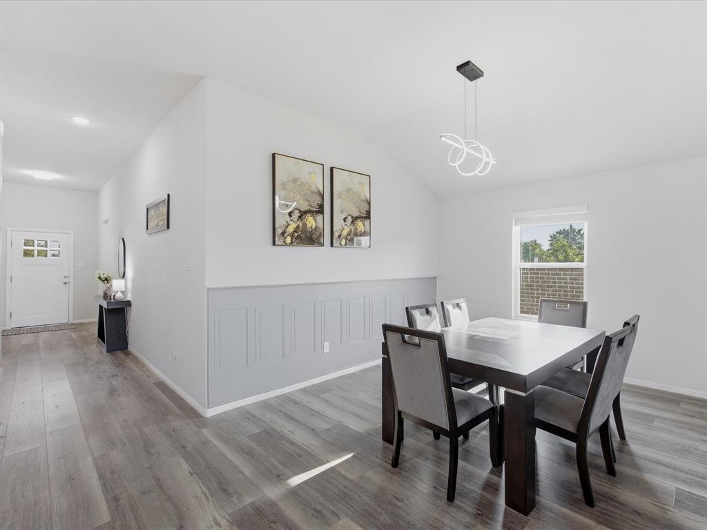 6000 Sutton Fields Trail Aubrey, TX 76227 - Photo 3 of 40 Dining area with light wood-style floors and lofted ceiling