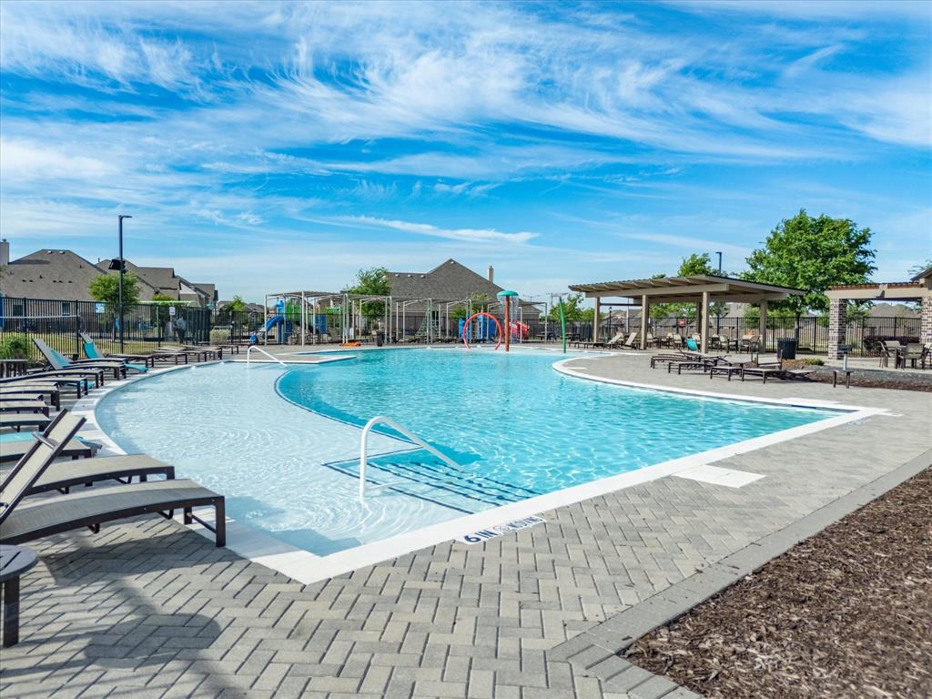 6000 Sutton Fields Trail Aubrey, TX 76227 - Photo 33 of 40 Community pool with a patio