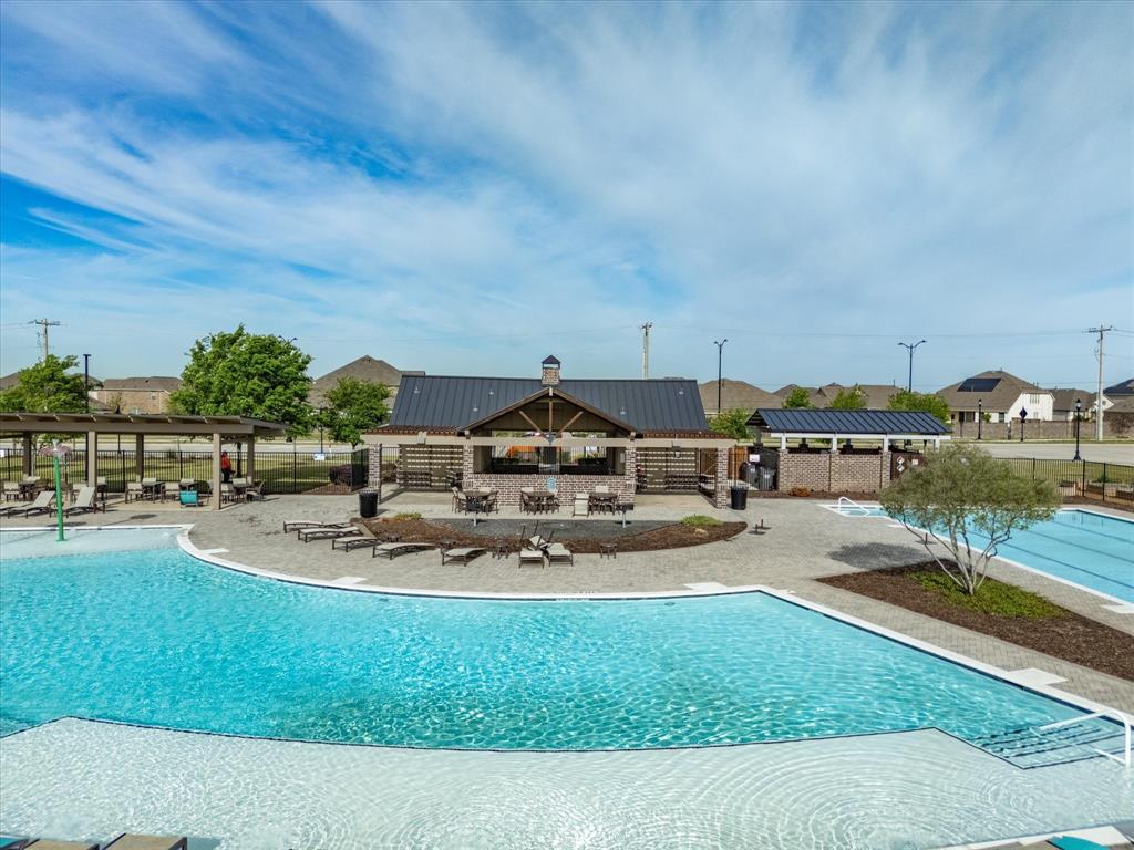 6000 Sutton Fields Trail Aubrey, TX 76227 - Photo 34 of 40 Community pool featuring a patio area