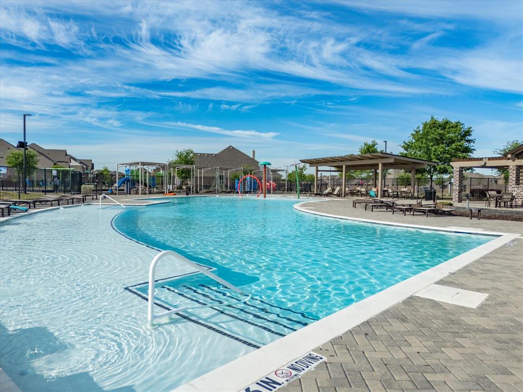 6000 Sutton Fields Trail Aubrey, TX 76227 - Photo 35 of 40 Community pool featuring a patio
