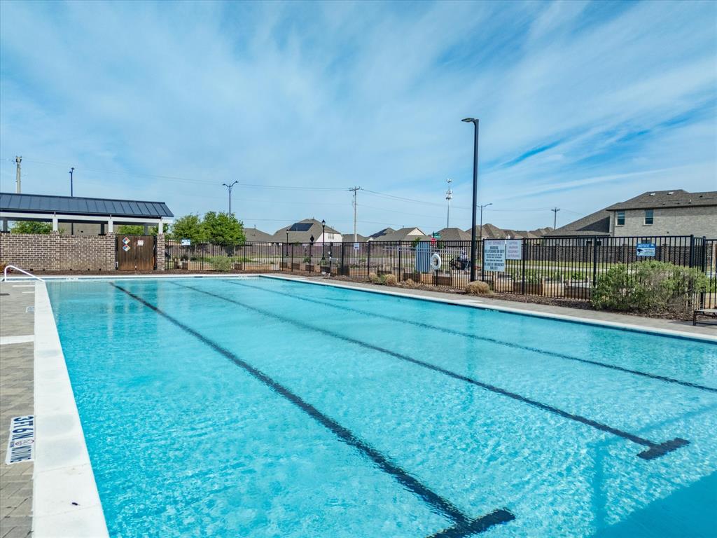 6000 Sutton Fields Trail Aubrey, TX 76227 - Photo 36 of 40 Community pool featuring a patio area and a residential view