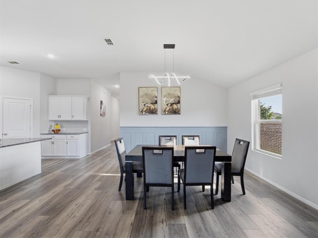 6000 Sutton Fields Trail Aubrey, TX 76227 - Photo 5 of 40 Dining space with light wood-style flooring and lofted ceiling