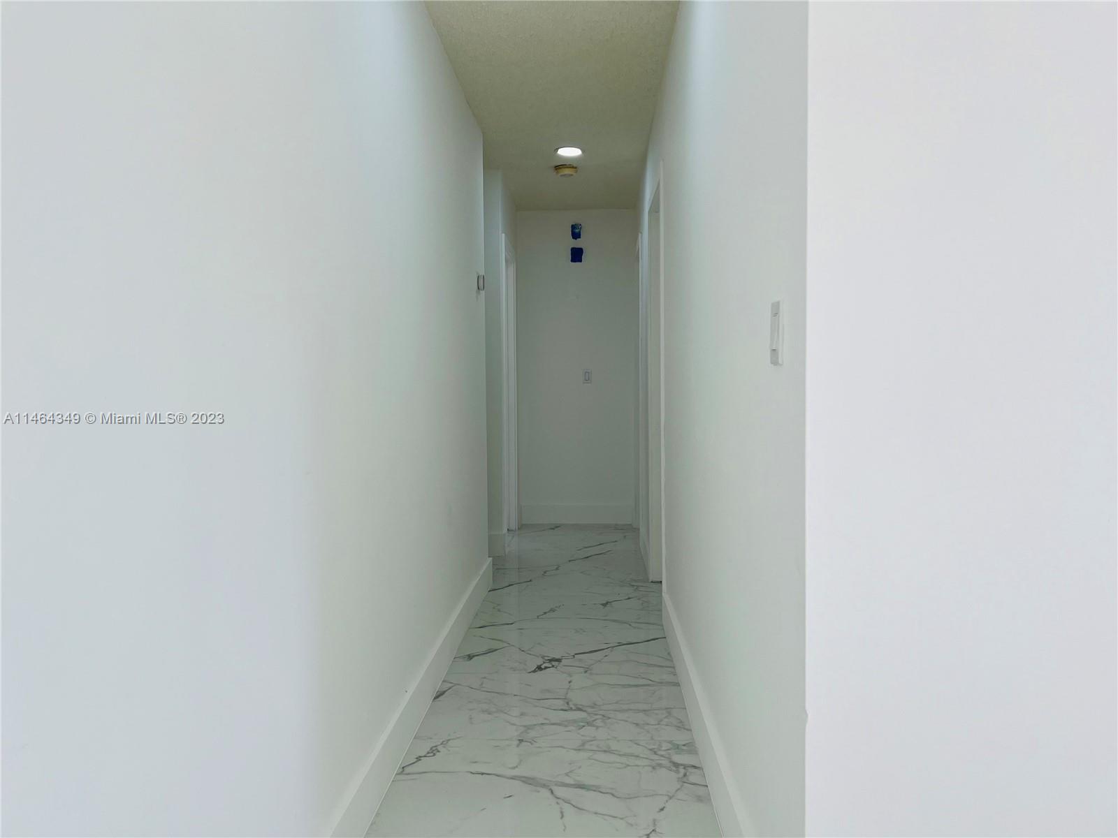 11301 Southwest 203rd Terrace Miami, FL 33189 - Photo 18 of 51 a view of a hallway