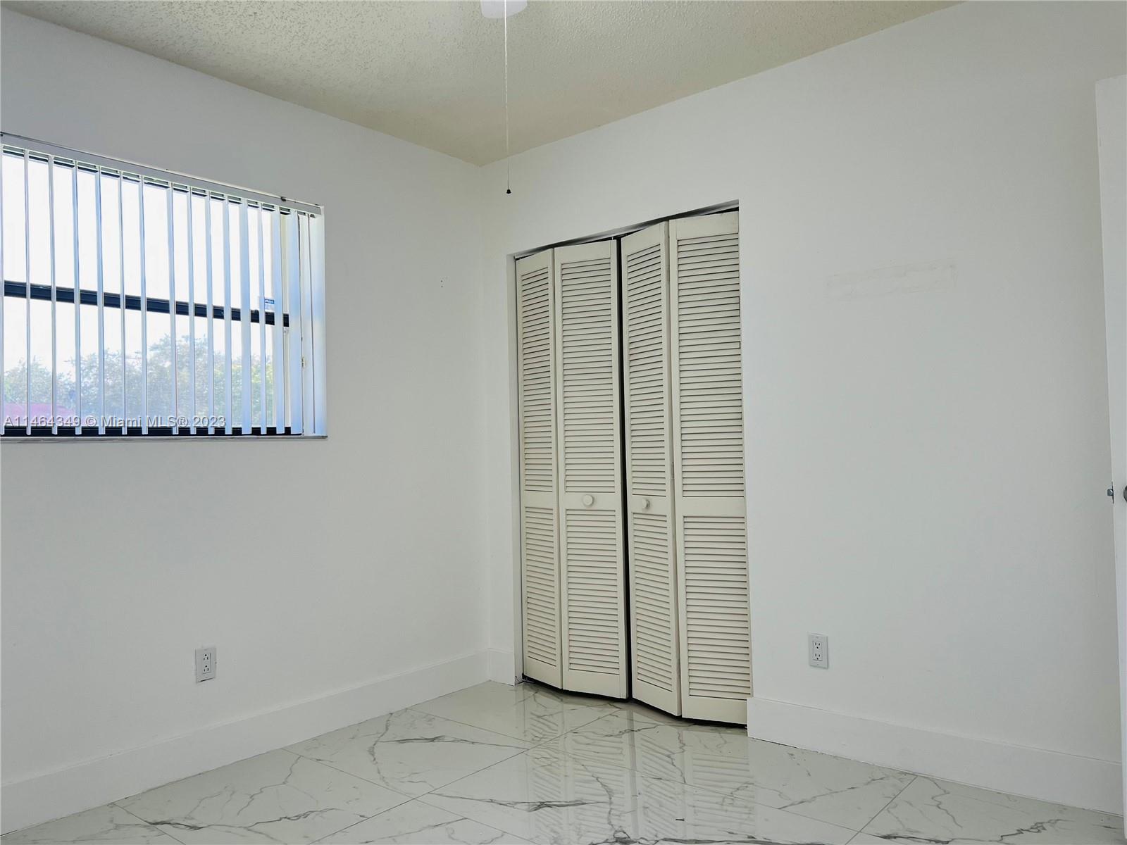 11301 Southwest 203rd Terrace Miami, FL 33189 - Photo 22 of 51 a view of a utility room with a door