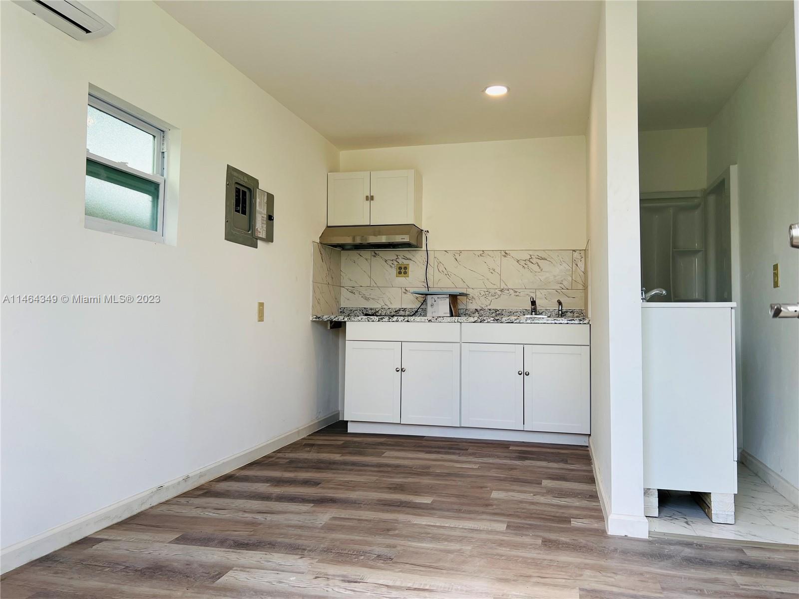 11301 Southwest 203rd Terrace Miami, FL 33189 - Photo 37 of 51 a view of kitchen with wooden floor