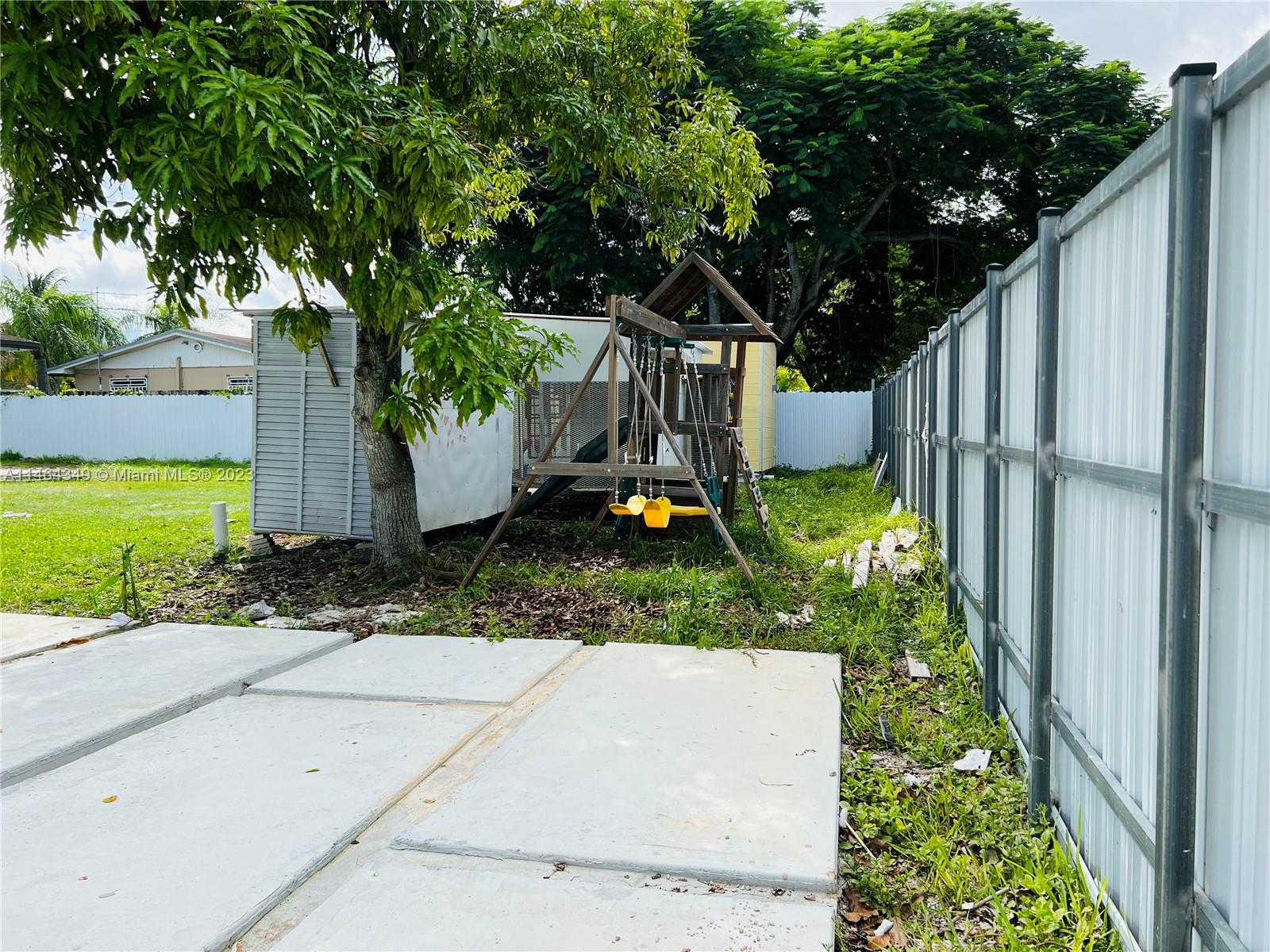 11301 Southwest 203rd Terrace Miami, FL 33189 - Photo 46 of 51 a view of a backyard with a garden
