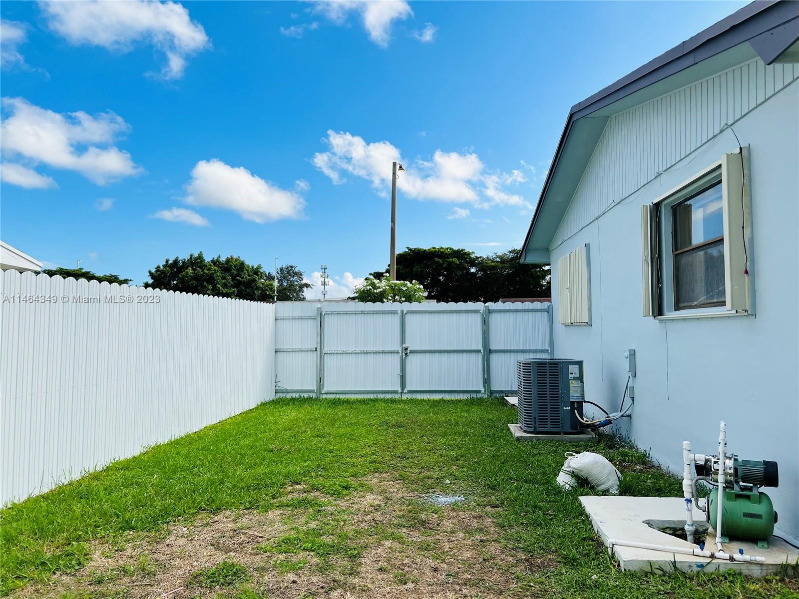 11301 Southwest 203rd Terrace Miami, FL 33189 - Photo 48 of 51 a view of a backyard with sitting area