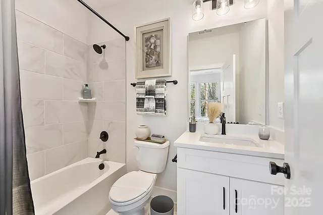 a bathroom with a sink toilet a shower and a mirror