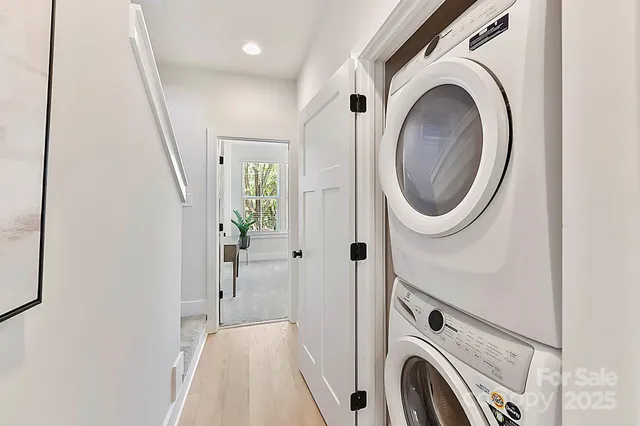 a view of a hallway with washer and dryer