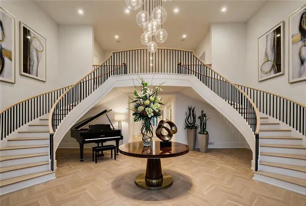 a view of a dining room with furniture and chandelier
