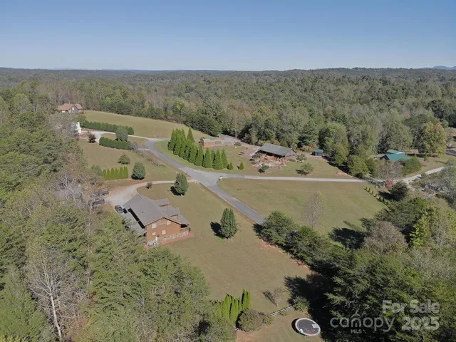 an aerial view of residential house with outdoor space