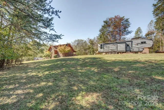 a view of a house with a yard and garage
