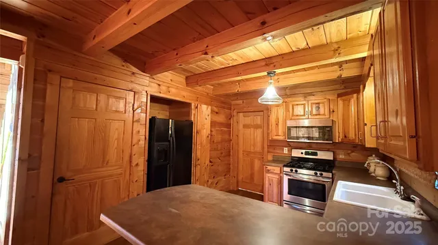 a bathroom with a toilet and a shower curtain
