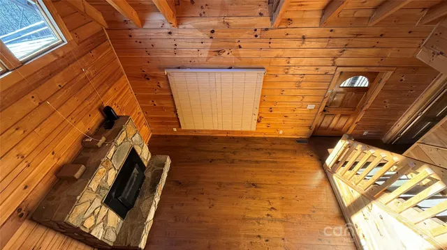 a view of a dry yard with trees